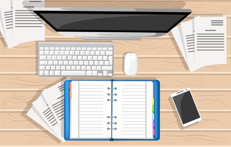 Computer and notebook on desktop